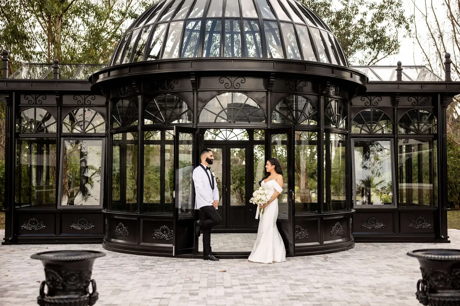 The glass conservatory ceremony structure under a blue sky
